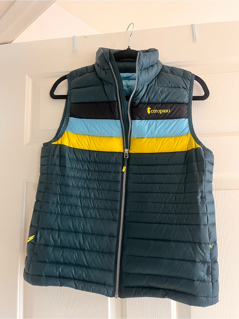 cotopaxi Teal Kids Puffer Vest with Yellow & Light Blue Stripes